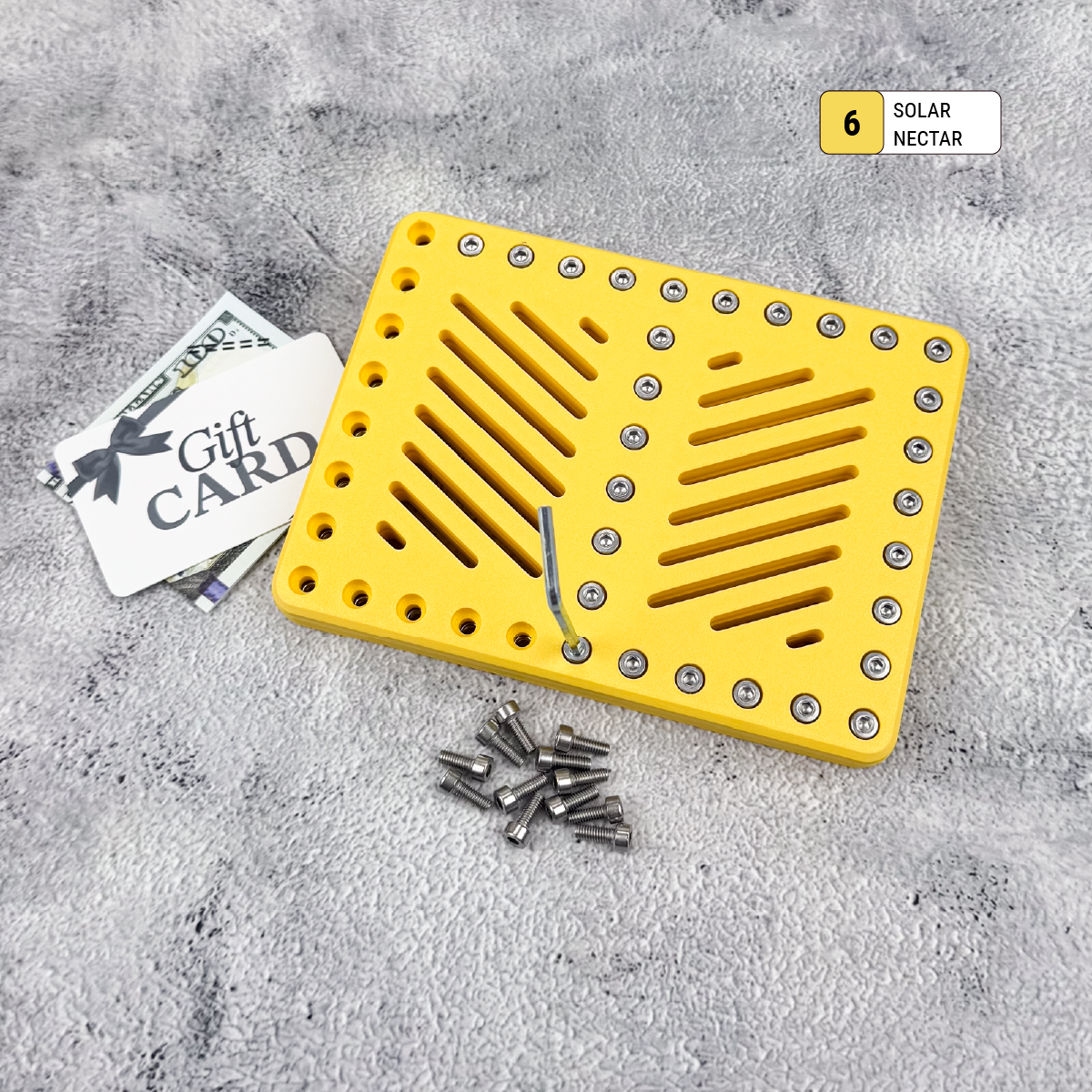 Yellow Lockup Duo gift card holder closed with Allen wrench and screws beside it